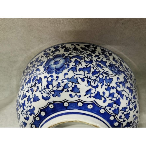 84 - Very large decorative blue and white ceramic bowl  18.5cm high, 41 cm diameter
2cm old repair
No pos... 