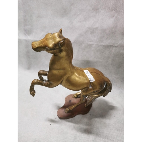 86 - Pair of vintage solid brass horses on plinths one rearing one cantering, total weight of 7.6kg