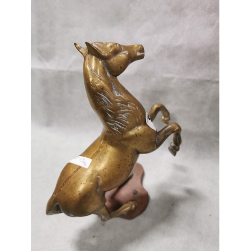 86 - Pair of vintage solid brass horses on plinths one rearing one cantering, total weight of 7.6kg