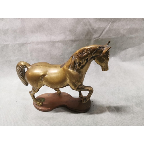 86 - Pair of vintage solid brass horses on plinths one rearing one cantering, total weight of 7.6kg