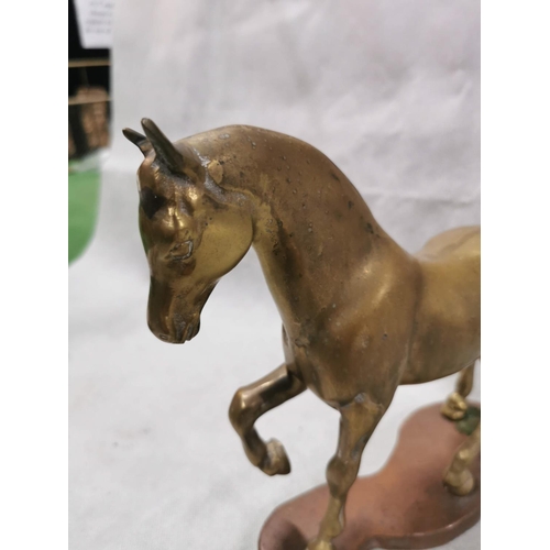 86 - Pair of vintage solid brass horses on plinths one rearing one cantering, total weight of 7.6kg