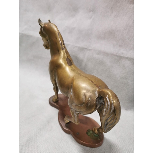 86 - Pair of vintage solid brass horses on plinths one rearing one cantering, total weight of 7.6kg