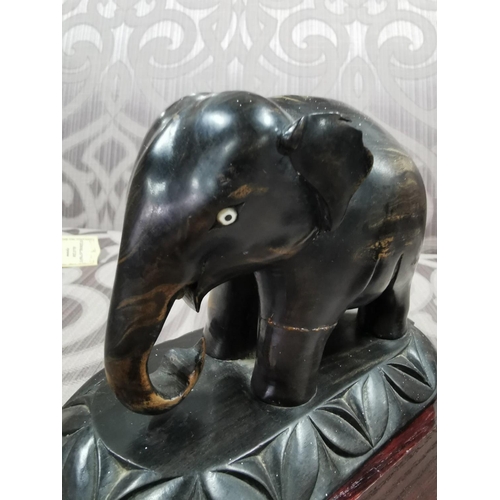 24 - 4 elephants, two resin, two ebony carved book ends. The book ends have old repairs, good detailing