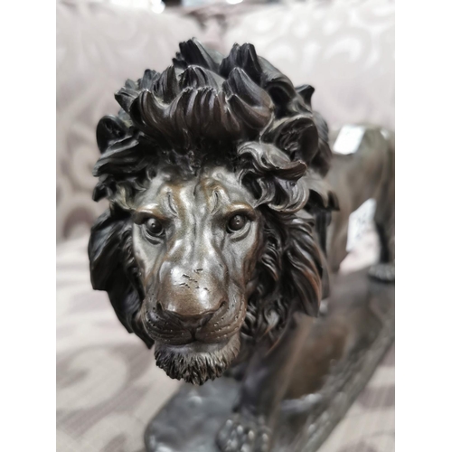 25 - one resin bronze colour lion and one crystal glass lion on plinths. Height of largest item is 23cm x... 