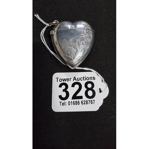 328 - Hm silver heart formed vesta case with an etched design and a striker to the side is hallmarked for ... 