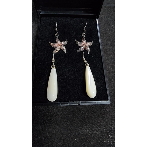 331 - 2 pairs of 925 silver earrings, a set of MOP earrings and starfish ones both marked 925