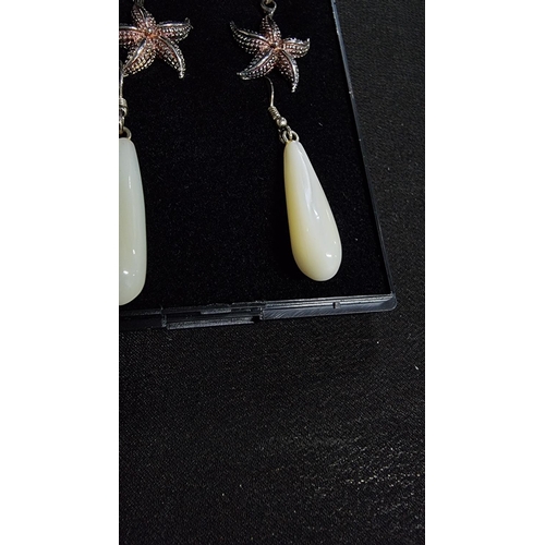 331 - 2 pairs of 925 silver earrings, a set of MOP earrings and starfish ones both marked 925