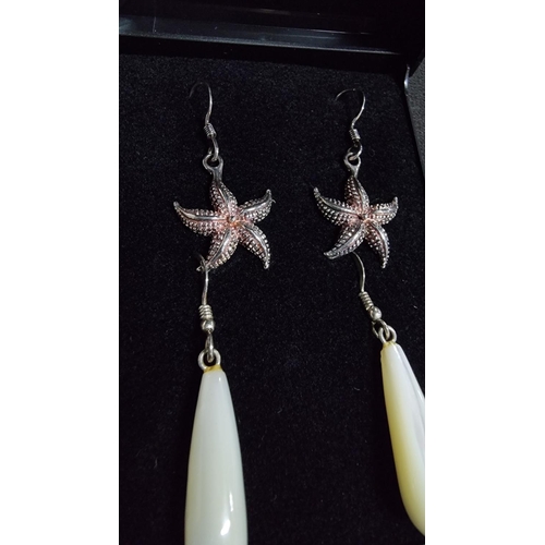 331 - 2 pairs of 925 silver earrings, a set of MOP earrings and starfish ones both marked 925