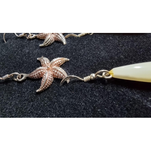 331 - 2 pairs of 925 silver earrings, a set of MOP earrings and starfish ones both marked 925