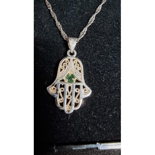 332 - 925 silver hand pendant with green stone on an 18