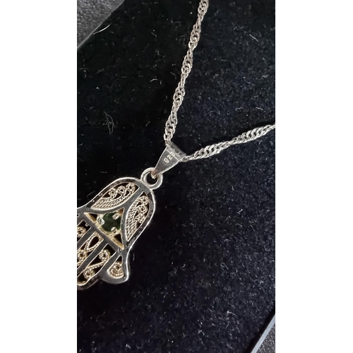 332 - 925 silver hand pendant with green stone on an 18