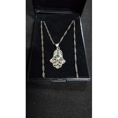 332 - 925 silver hand pendant with green stone on an 18