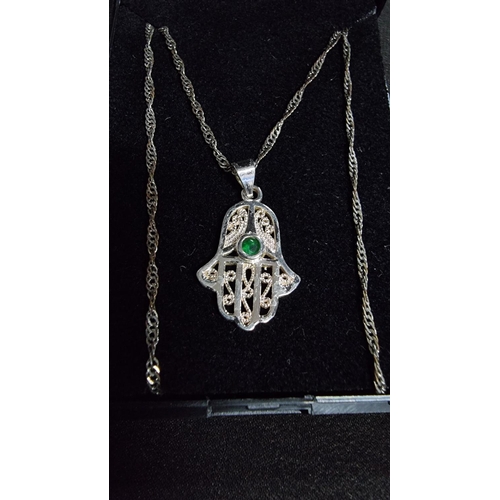 332 - 925 silver hand pendant with green stone on an 18