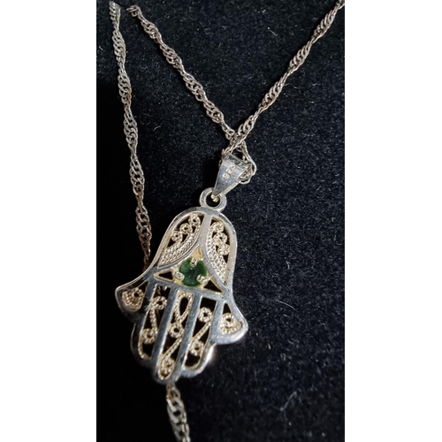 332 - 925 silver hand pendant with green stone on an 18