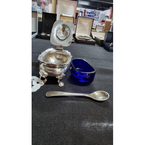 334 - H.M. silver salt with a crystal blue glass liner and an EPNS salt spoon. Total weight of silver salt... 