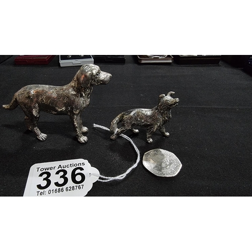 336 - 2 well modelled white metal dog figures in good condition the larger 6.5cm high length 10 cm ,smalle... 