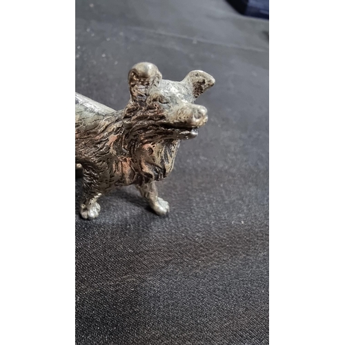 336 - 2 well modelled white metal dog figures in good condition the larger 6.5cm high length 10 cm ,smalle... 