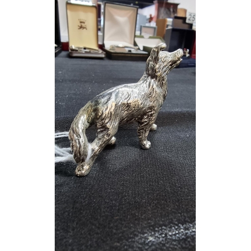 336 - 2 well modelled white metal dog figures in good condition the larger 6.5cm high length 10 cm ,smalle... 