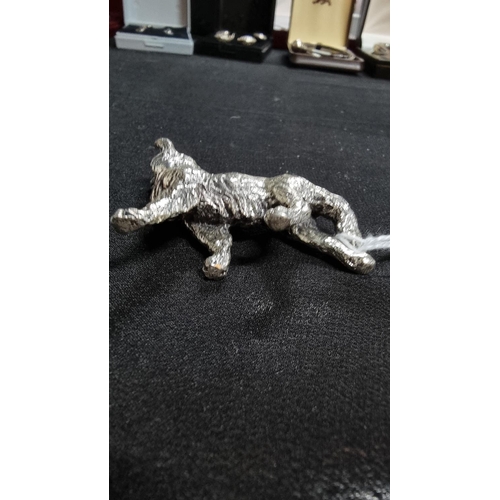 336 - 2 well modelled white metal dog figures in good condition the larger 6.5cm high length 10 cm ,smalle... 