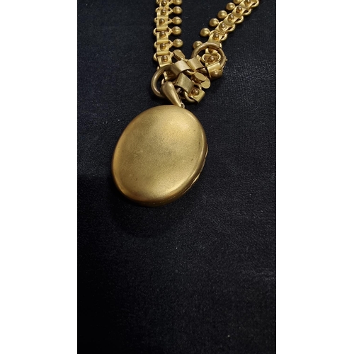 340 - Vintage gold plated large locket on an unusual plated chain in good order. locket high 4.5cm x 3.5cm... 