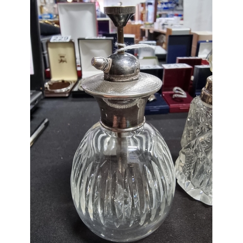 187 - Quantity of 4 scent bottles with hallmarked silver collars and a silver topped atomizer