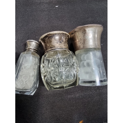 190 - 3 x sterling silver scent bottles all with guilloche topps