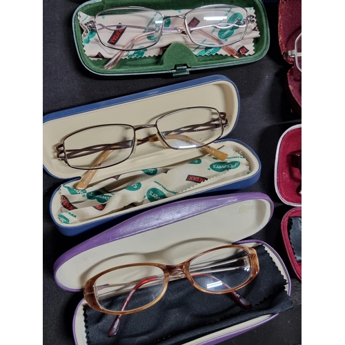 198 - Collection of 8 pairs of spectacles all in cases inc a pair of octagonal framed glasses