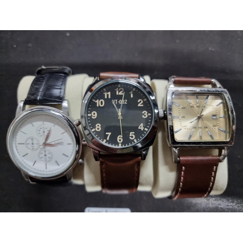 200 - Quantity of three modern gents watches by Next all on good chunky leather straps all in working orde... 