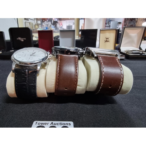 200 - Quantity of three modern gents watches by Next all on good chunky leather straps all in working orde... 