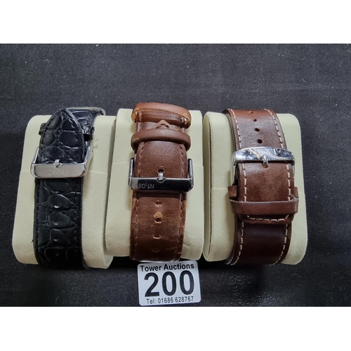 200 - Quantity of three modern gents watches by Next all on good chunky leather straps all in working orde... 