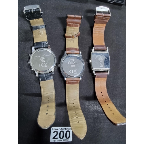 200 - Quantity of three modern gents watches by Next all on good chunky leather straps all in working orde... 