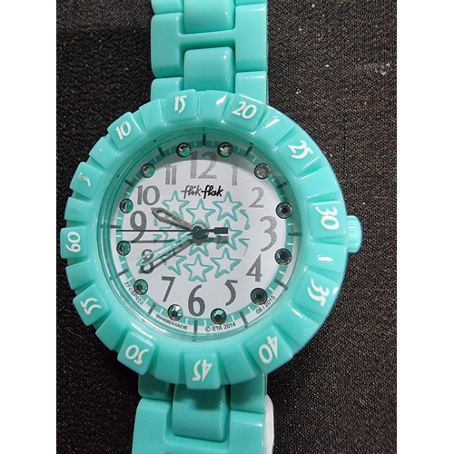 203 - Ladies collectable Flik Flak swiss made watch in a turquoise colour and a jewelled dial, made in may... 