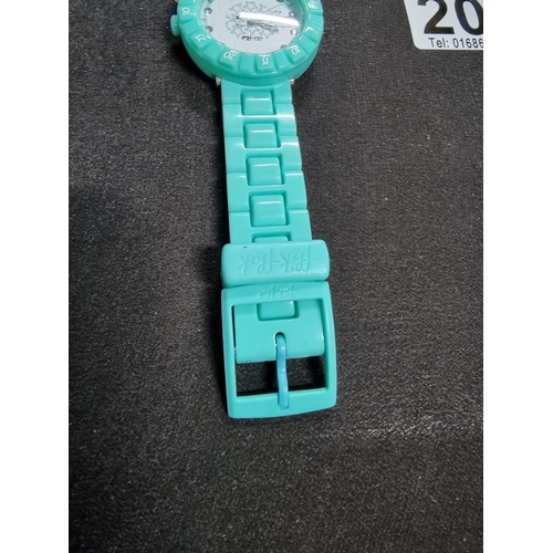 203 - Ladies collectable Flik Flak swiss made watch in a turquoise colour and a jewelled dial, made in may... 