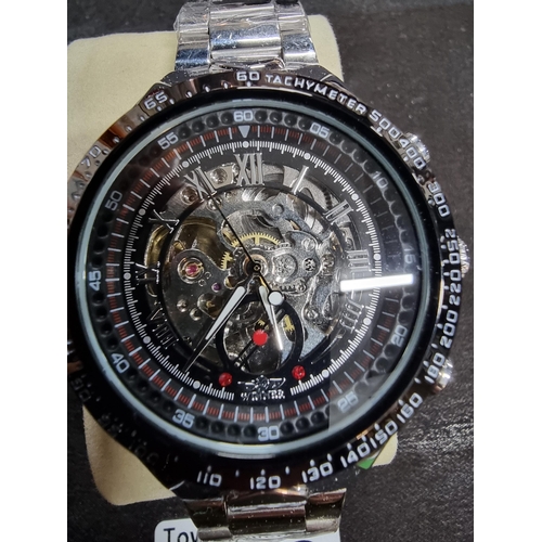 208 - New ex display silvertone gents wrist watch by Winner featuring a skeleton dial still has the wrappi... 