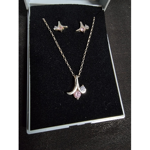 217 - 925 silver matching suite pendant necklace and earrings with pink and clear stones on a long 22in si... 