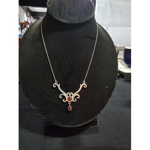 220 - 925 sterling silver pendant inset with two garnet stones on a 16in 925 silver chain gem stones teste... 