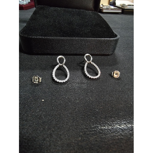 225 - Pair of 925 earrings by diamon fire inset with a quantity of cz stones in very good condition