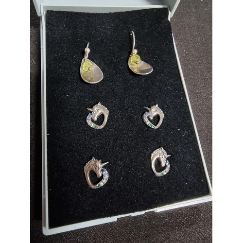 227 - suite of three pairs of 925 silver earrings inc 2 matching pairs of unicorn stud earrings and a pair... 