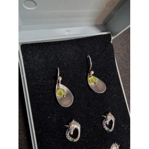 227 - suite of three pairs of 925 silver earrings inc 2 matching pairs of unicorn stud earrings and a pair... 