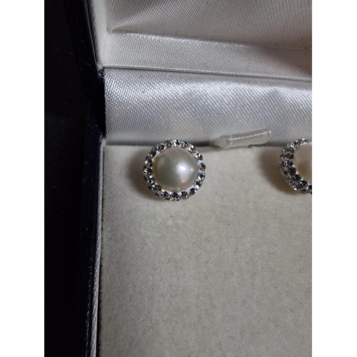 235 - Pair of new old stock 925 silver earrings inset with genuine pearls and cz stones