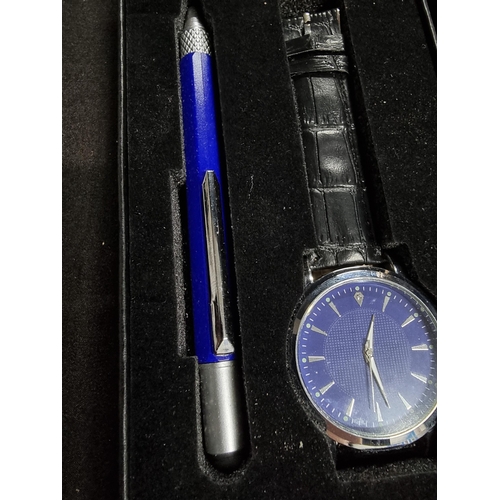 238 - Modern as new boxed and unused gents birthday gift set with apen and watch with a gem to the side