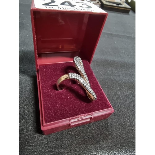 243 - Gold on 925 silver ornate snake ring inset with a large quantity of cz stones marked 925 in good con... 