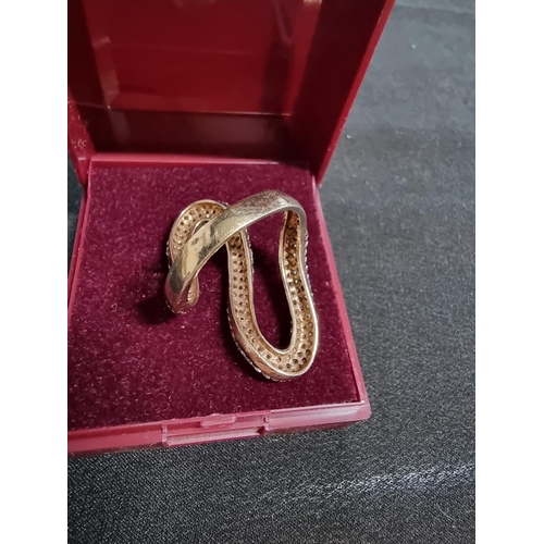 243 - Gold on 925 silver ornate snake ring inset with a large quantity of cz stones marked 925 in good con... 