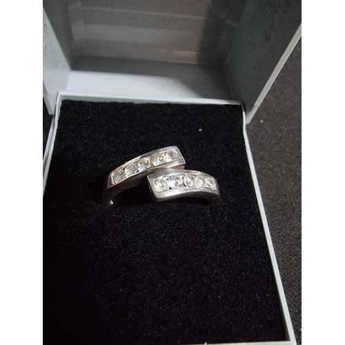 246 - 925 silver expandable ring inset with a quantity of CZ stones in good clean condition, size 'O' and ... 