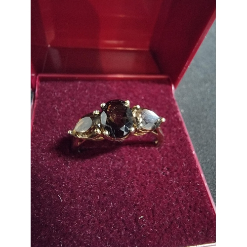 247 - Good gold on 925 silver dress ring inset with three smokey quartz stones in good clean condition siz... 