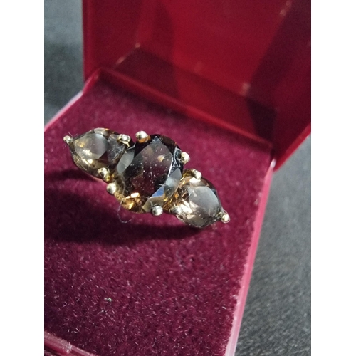 247 - Good gold on 925 silver dress ring inset with three smokey quartz stones in good clean condition siz... 