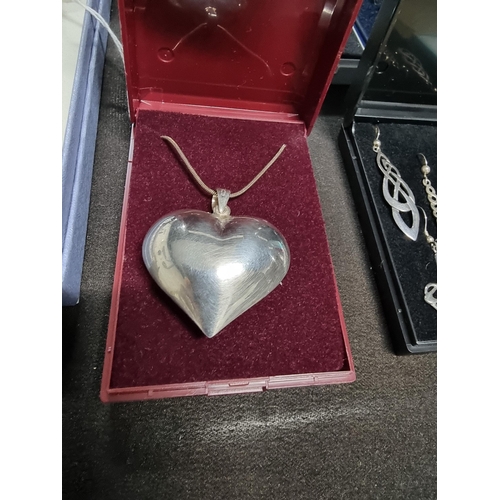 267 - Large 925 silver heart formed pendant on a long 925 silver chain height of pendant 4cm width 4cm tot... 