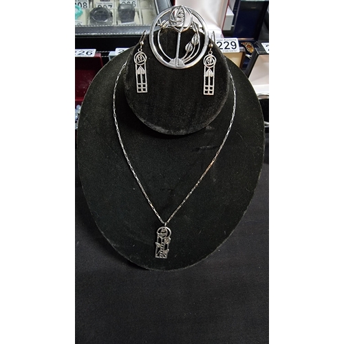 271 - 925 silver pendant on an 18inc chain along with a matching brooch and earrings with a Charles Rene m... 