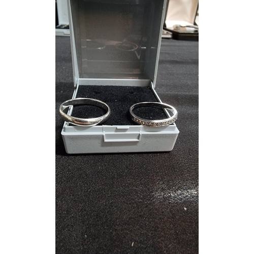 276 - 2 x 925 silver rings one is a plain band in good clean condition marked 925 size Q the other has a q... 