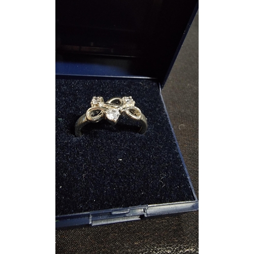 281 - 925 silver ring inset with three CZ stones in excellent clean condition marked 925 size P1/2 boxed